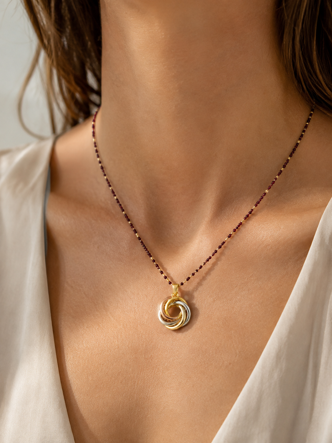 Colgante espiral oro 18k tricolor