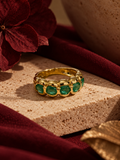Anillo cintillo de oro 18k y esmeraldas